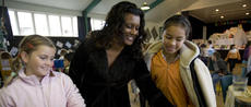 This is an image of a teacher with some students. 